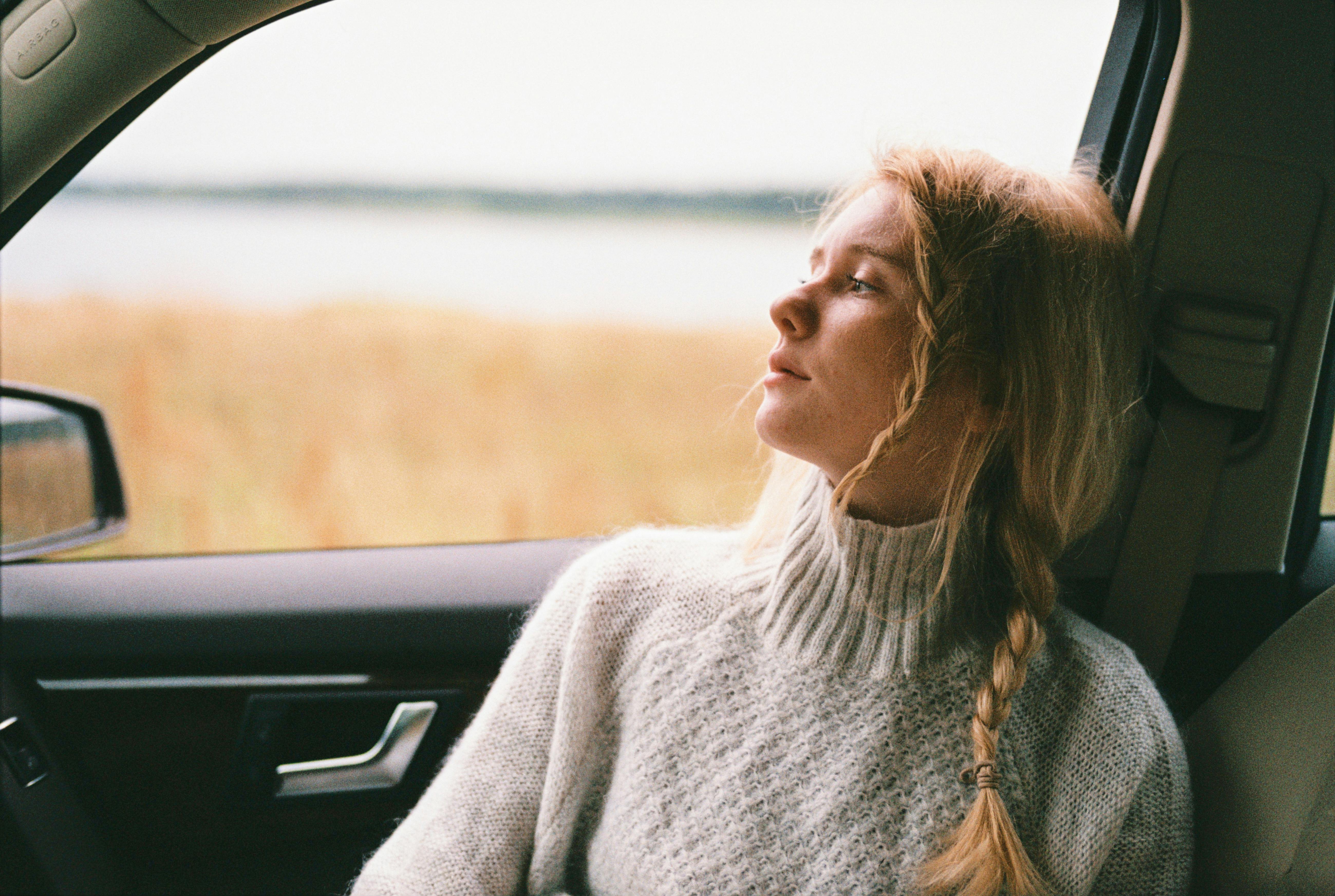 A vertical image of a person reflecting